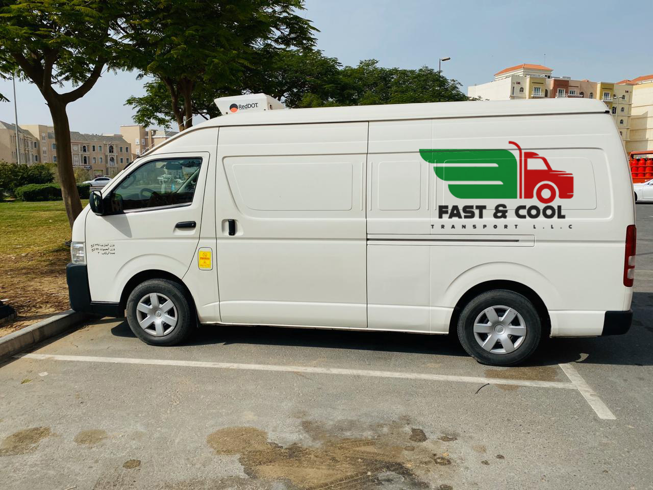 White chiller van in Abu Dhabi for reliable cold chain delivery of perishable goods across the UAE.