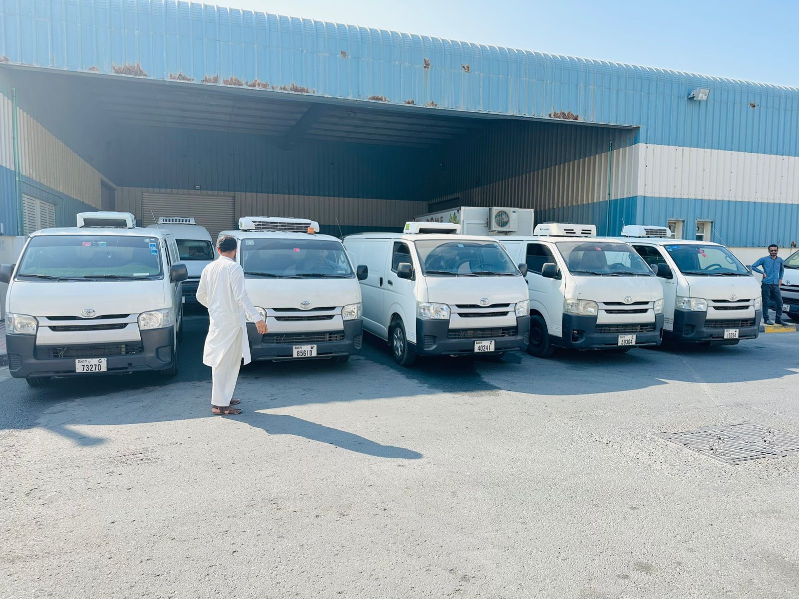 Fleet of refrigerated transport vans ready for cold chain delivery services in Dubai, Abu Dhabi, and across the UAE.