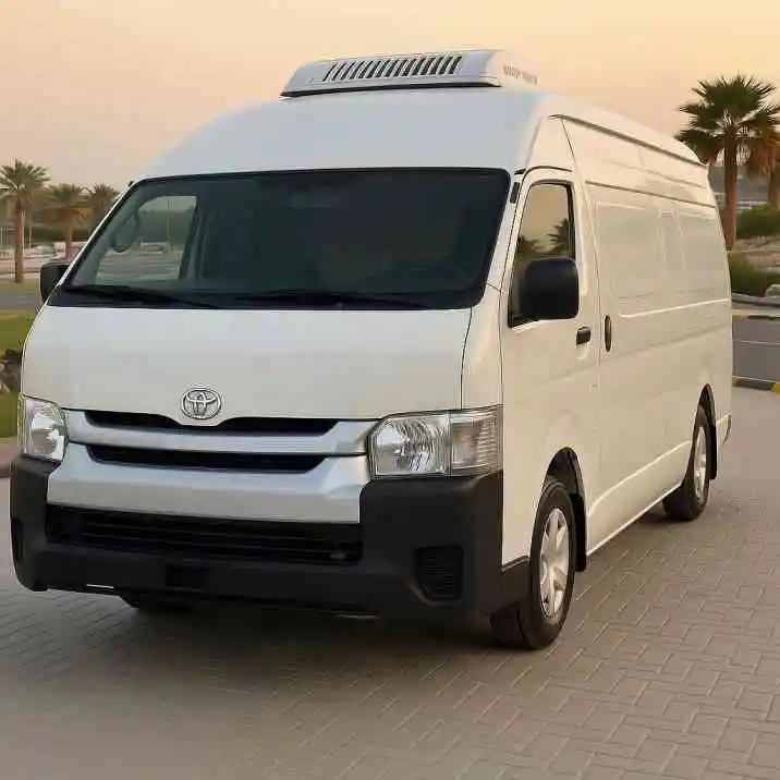 Modern white high roof van rental with advanced cooling system parked outdoors in UAE